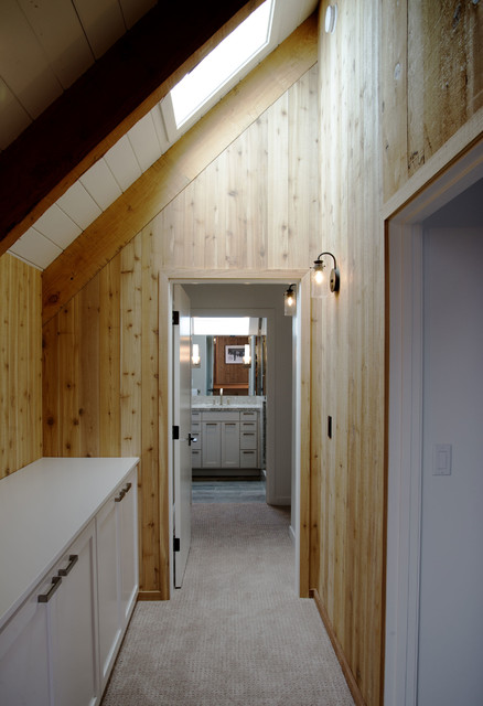 Vaulted Ceilings And Wood Wall Panels In Hallway Modern