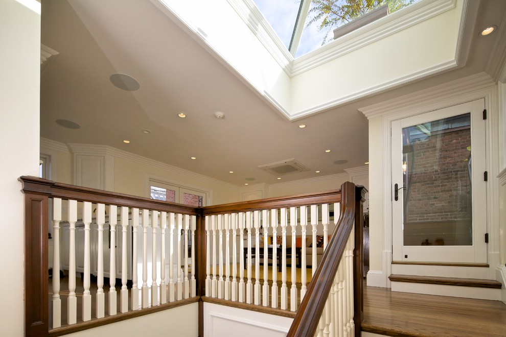 Inspiration for a mid-sized traditional wood l-shaped staircase in Boston with wood risers and wood railing.