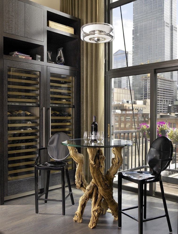 Inspiration for an industrial wine cellar in Chicago with storage racks and grey floor.