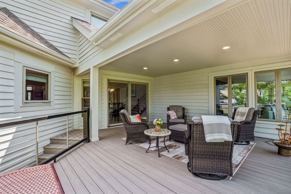 Deck - mid-sized transitional backyard second story cable railing deck idea in Columbus with a roof extension