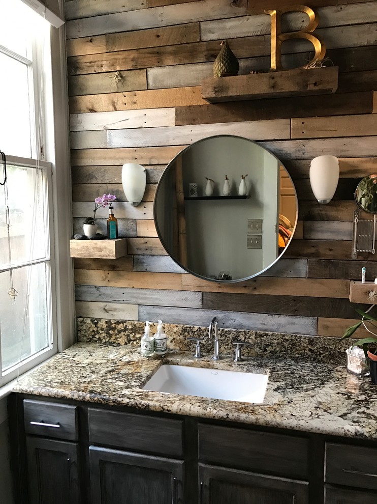 Mid-sized country master bathroom in New Orleans with recessed-panel cabinets, distressed cabinets, a one-piece toilet, multi-coloured tile, mirror tile, grey walls, slate floors, an undermount sink, granite benchtops, multi-coloured floor and a hinged shower door.