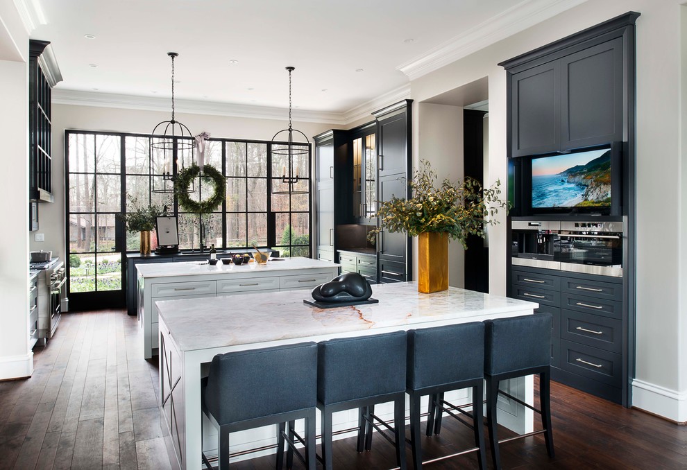 Kitchen - transitional u-shaped dark wood floor kitchen idea in Atlanta with quartzite countertops, two islands, recessed-panel cabinets and gray cabinets