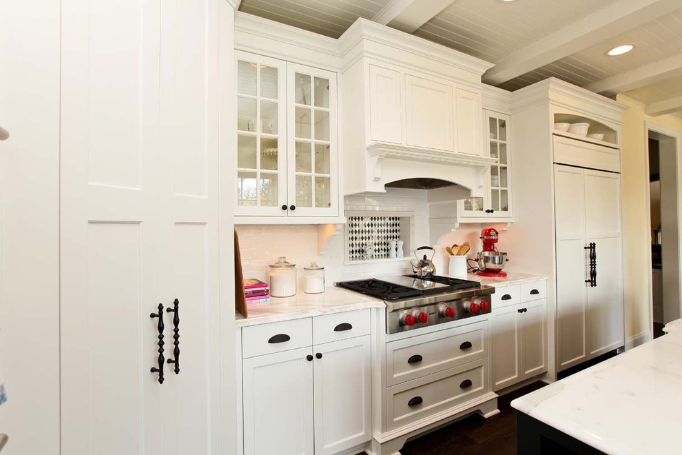 Design ideas for a traditional kitchen in Minneapolis with recessed-panel cabinets, white cabinets, white splashback and panelled appliances.