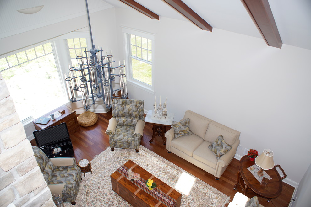 Example of a mid-sized transitional dark wood floor hallway design with white walls