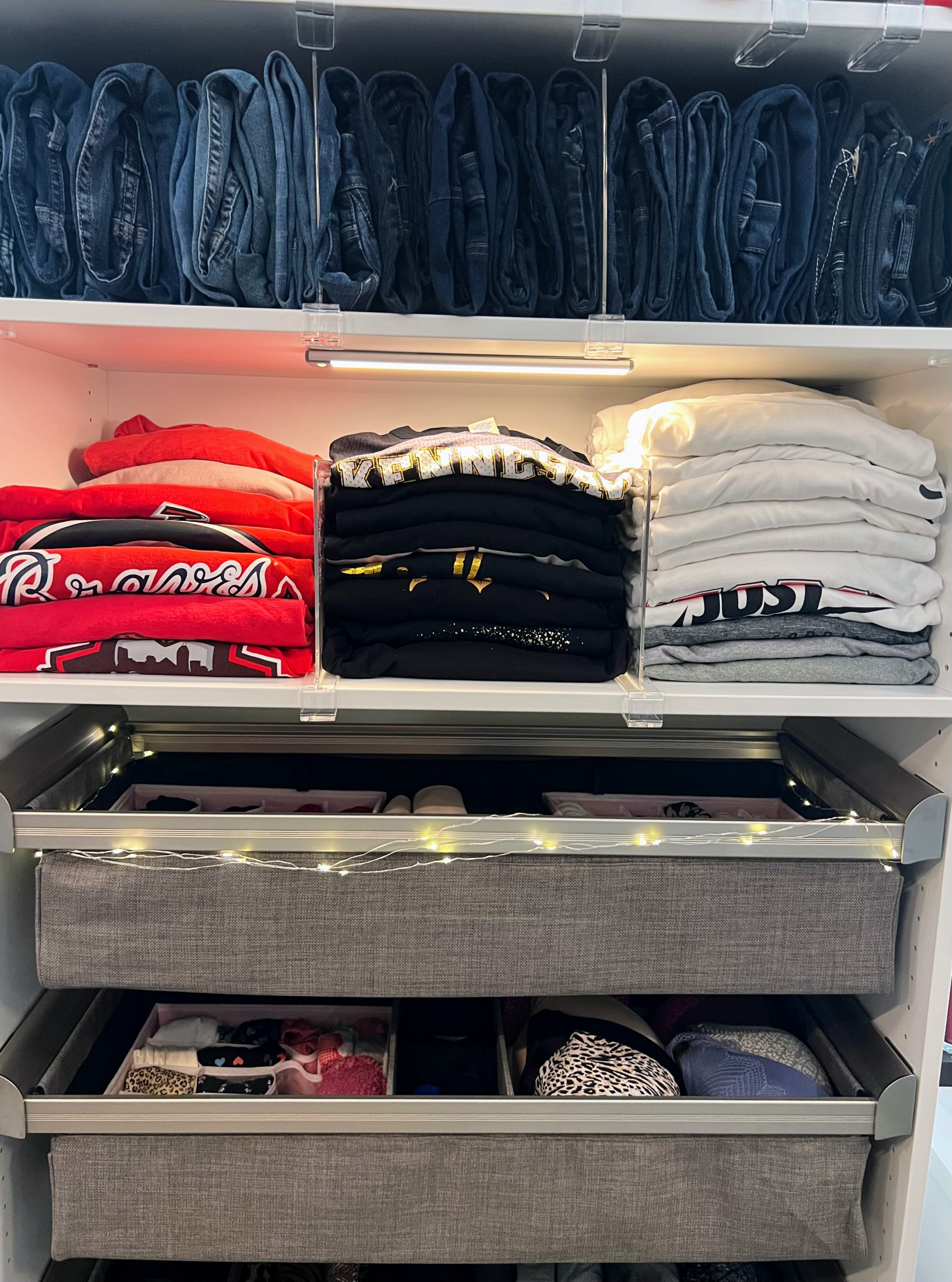 An image of a custom closet with adjustable drawer dividers completed by Calming Home by Venus