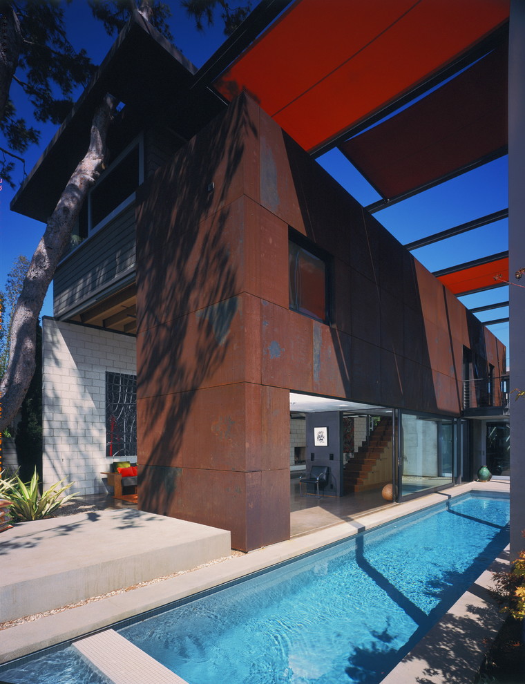 This is an example of a mid-sized industrial two-storey exterior in Los Angeles with metal siding.