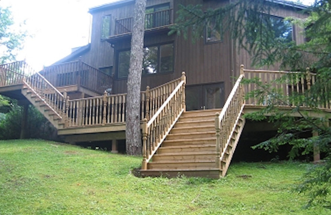 Inspiration for a side yard balcony deck remodel with no cover