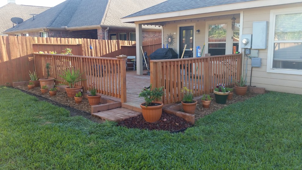 Mid-sized eclectic backyard patio in Houston with a container garden, decking and no cover.