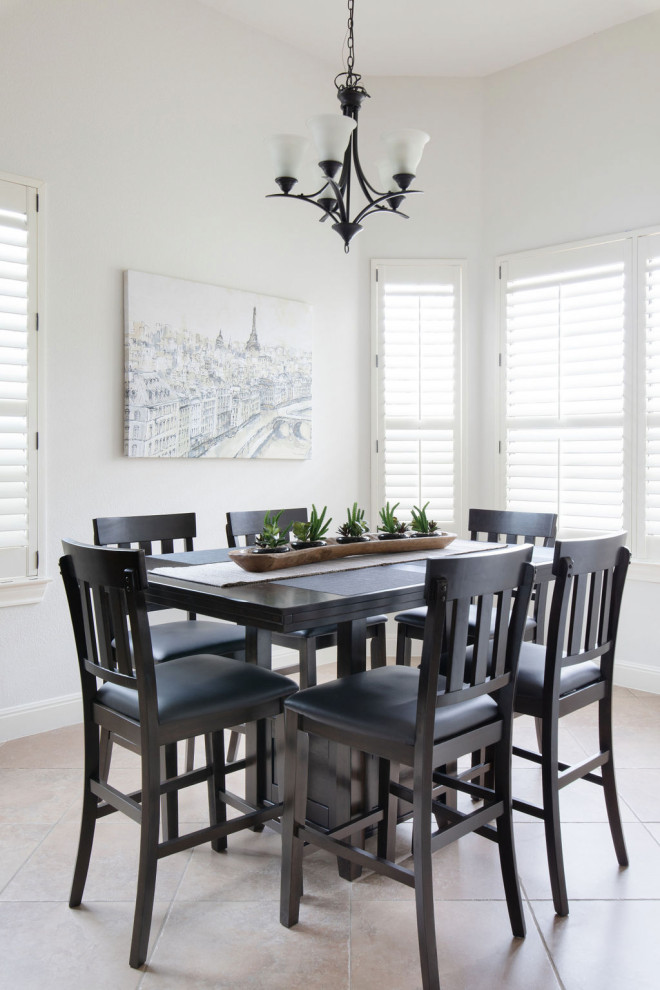 This is an example of a classic dining room in Austin with banquette seating and ceramic flooring.