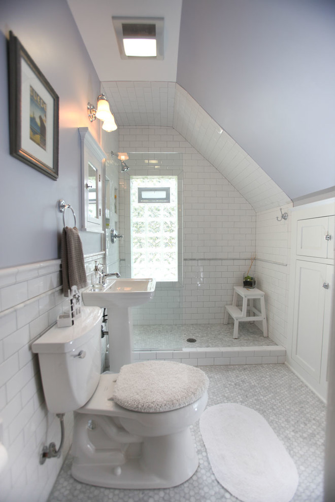 Inspiration for a mid-sized traditional 3/4 bathroom in Minneapolis with recessed-panel cabinets, white cabinets, an open shower, a two-piece toilet, gray tile, white tile, stone tile, purple walls, mosaic tile floors, a pedestal sink and solid surface benchtops.