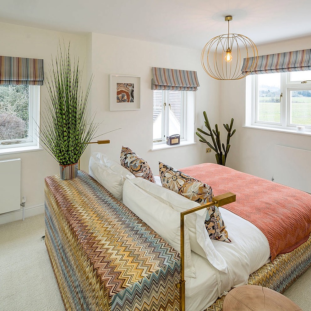 Design ideas for a transitional bedroom in Surrey.