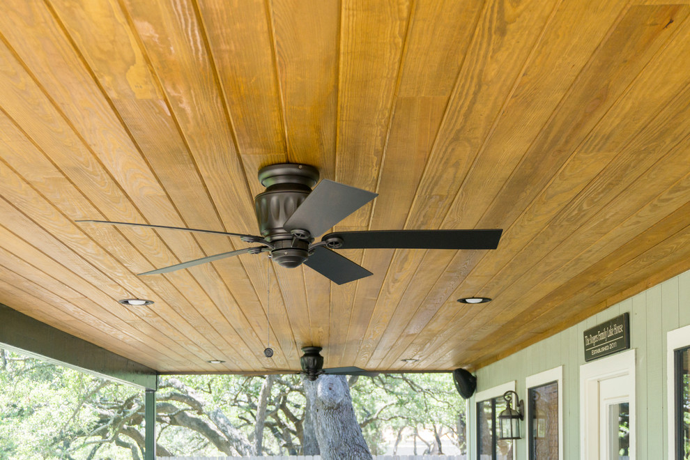 Example of a large mountain style backyard balcony deck design in Austin