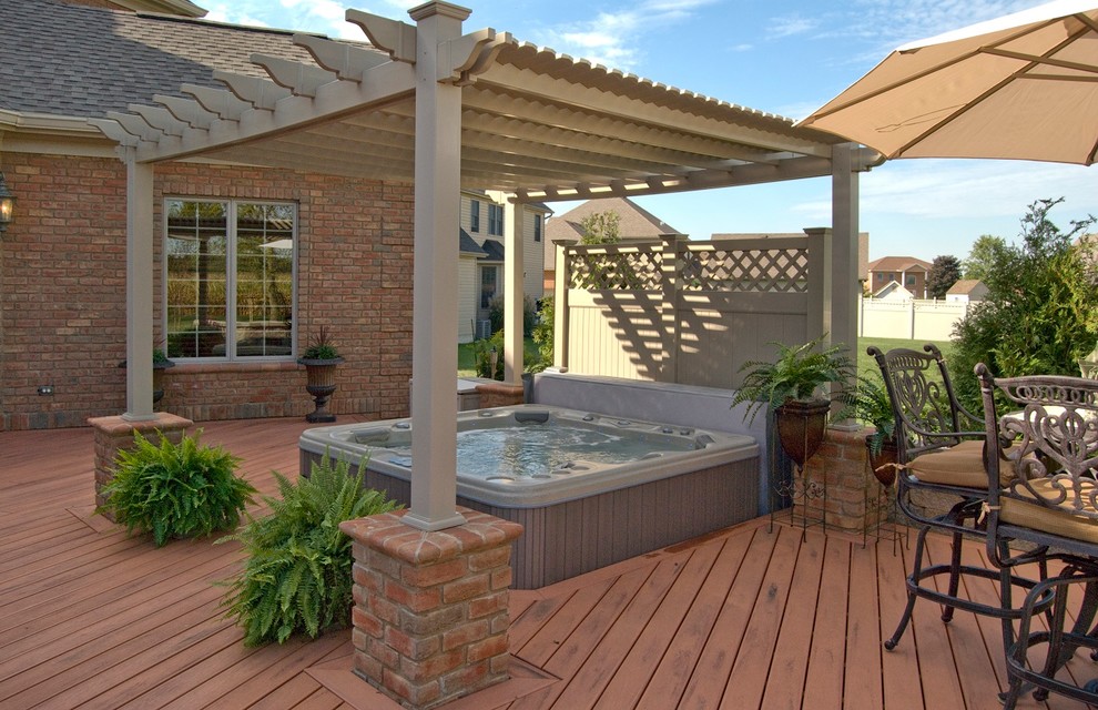 Design ideas for an expansive eclectic backyard deck in Nashville with a pergola.