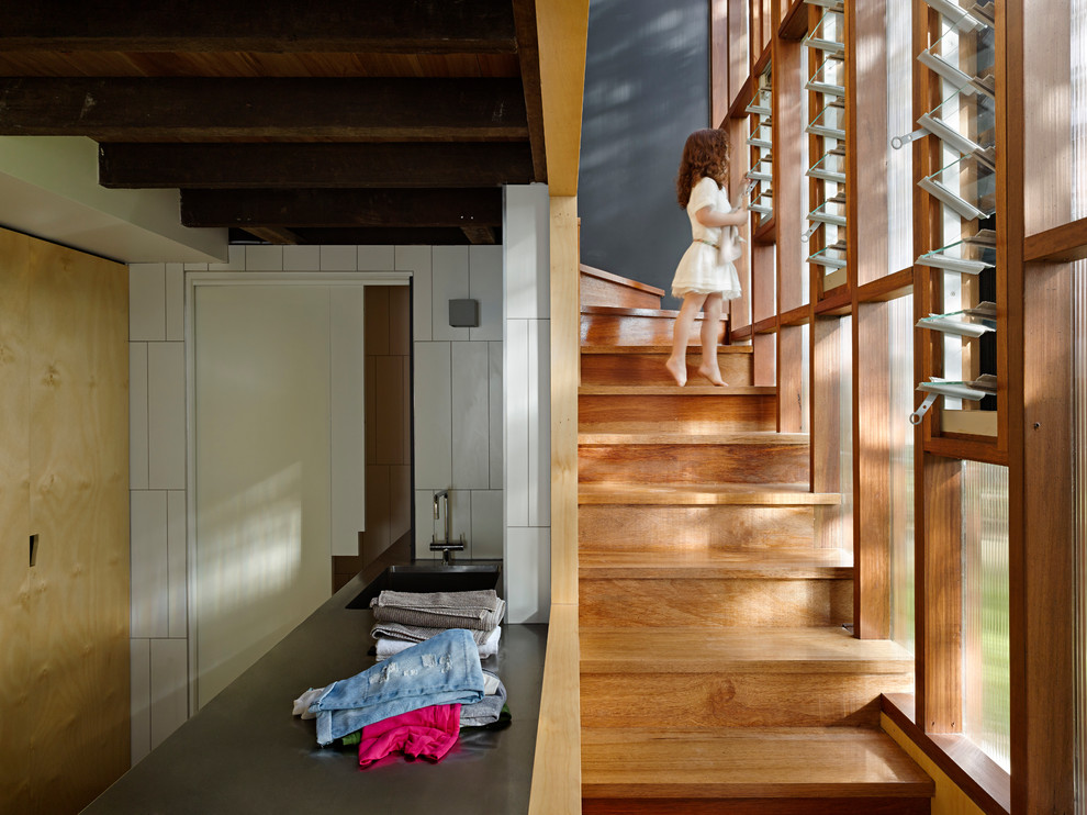 Inspiration for a mid-sized contemporary wood straight staircase in Brisbane with wood risers.
