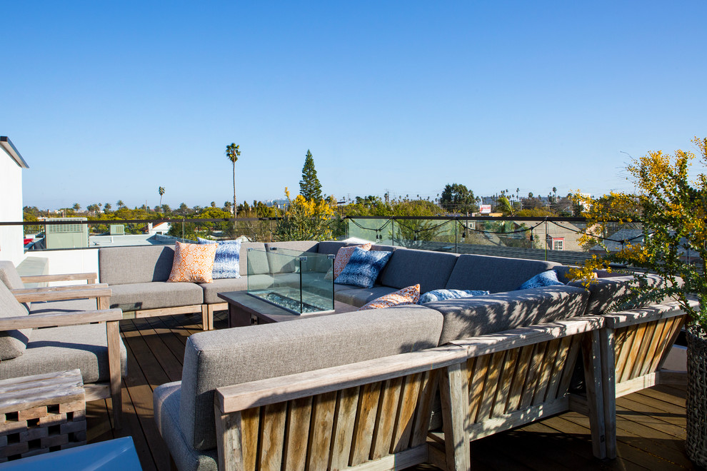 Inspiration for a large contemporary rooftop and rooftop deck in Los Angeles with a fire feature and no cover.
