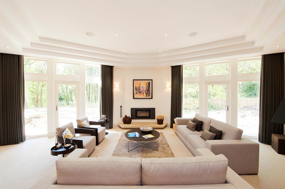 Large contemporary formal open concept living room in Other with white walls, carpet, a ribbon fireplace, no tv and a stone fireplace surround.
