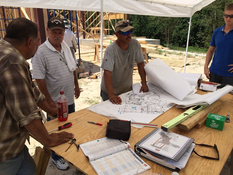 Job site meeting between project manager & steel contractor.