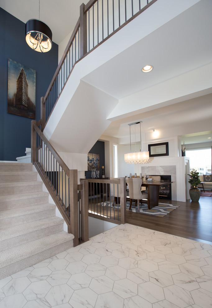 Foyer - huge contemporary porcelain tile foyer idea with blue walls and a blue front door