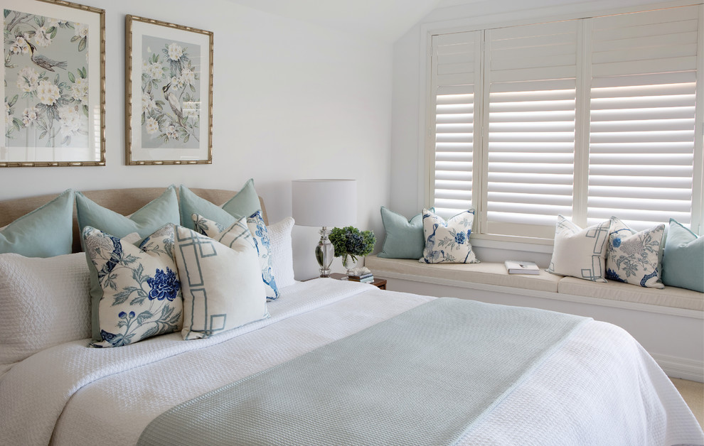Photo of a transitional master bedroom in Brisbane with white walls, carpet and beige floor.