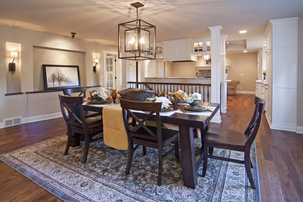 Inspiration for a traditional dining room in Minneapolis with beige walls and dark hardwood floors.