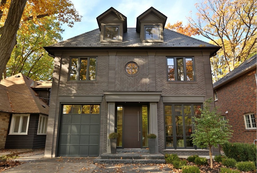 This is an example of a large contemporary two-storey brick brown exterior in Toronto with a hip roof.