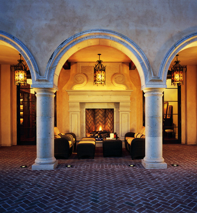 Inspiration for an expansive traditional courtyard patio in Denver with a fire feature, brick pavers and no cover.