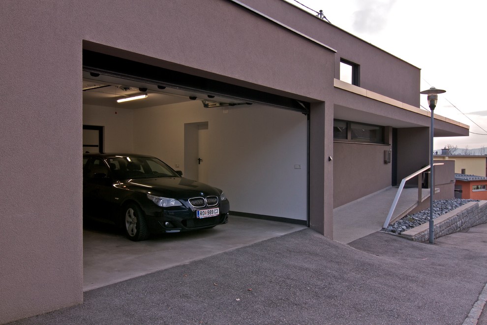 This is an example of a contemporary garage in Other.
