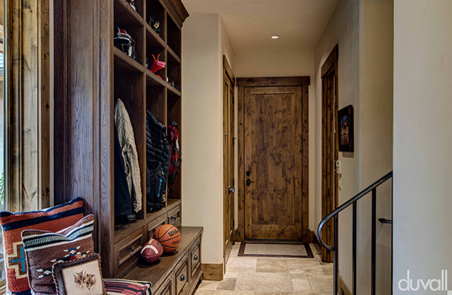 Inspiration for a rustic ceramic tile and beige floor entryway remodel with beige walls