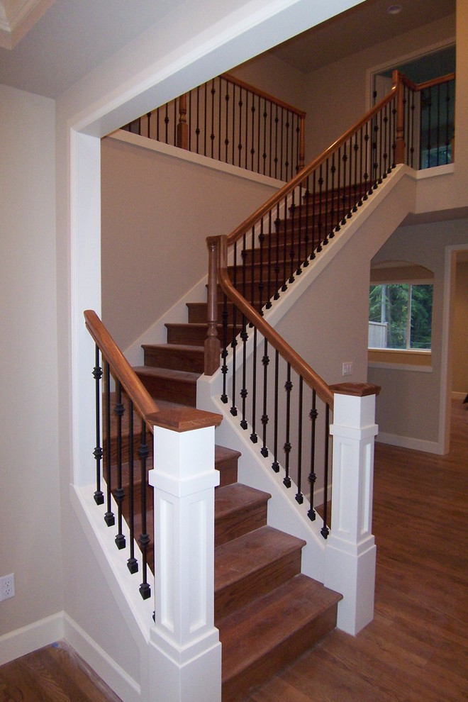 Example of a mid-sized arts and crafts wooden l-shaped staircase design in Seattle with wooden risers