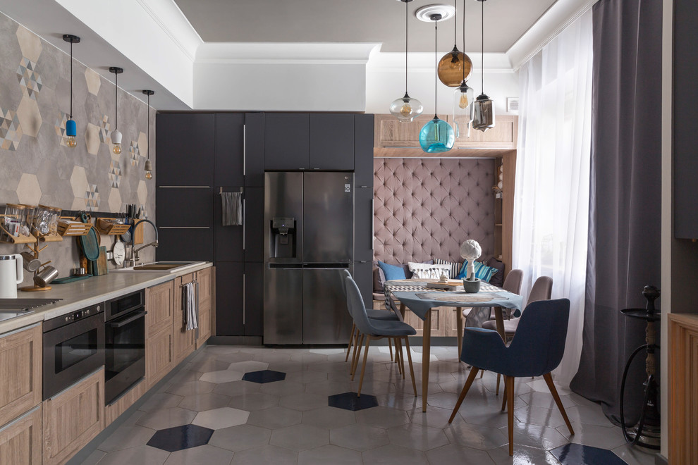 Inspiration for a contemporary l-shaped kitchen in London with ceramic floors, grey floor, recessed-panel cabinets, medium wood cabinets, beige splashback, no island and beige benchtop.