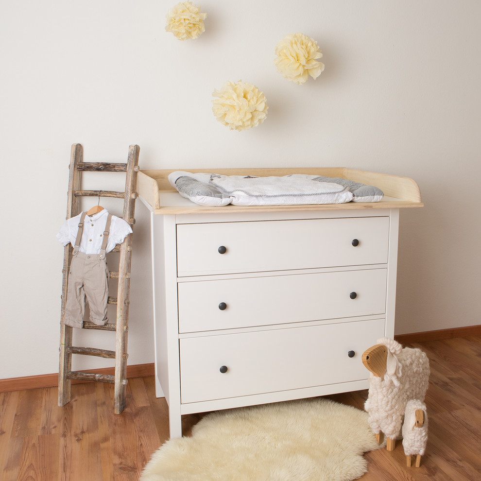 Inspiration for a mid-sized country gender-neutral nursery in Cologne with white walls and dark hardwood floors.