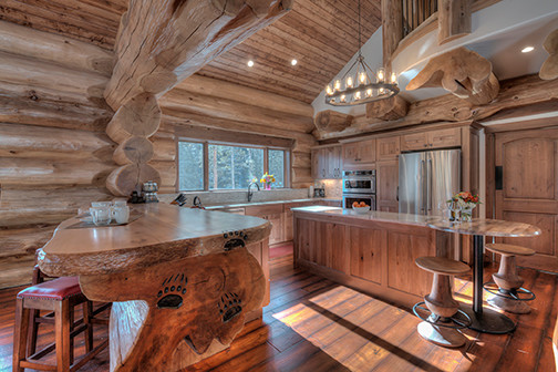 Inspiration for a mid-sized rustic u-shaped open concept kitchen remodel in Denver with shaker cabinets, medium tone wood cabinets and two islands