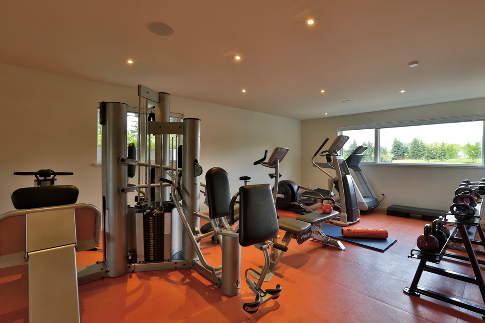 Inspiration for a small modern home weight room in Other with white walls.