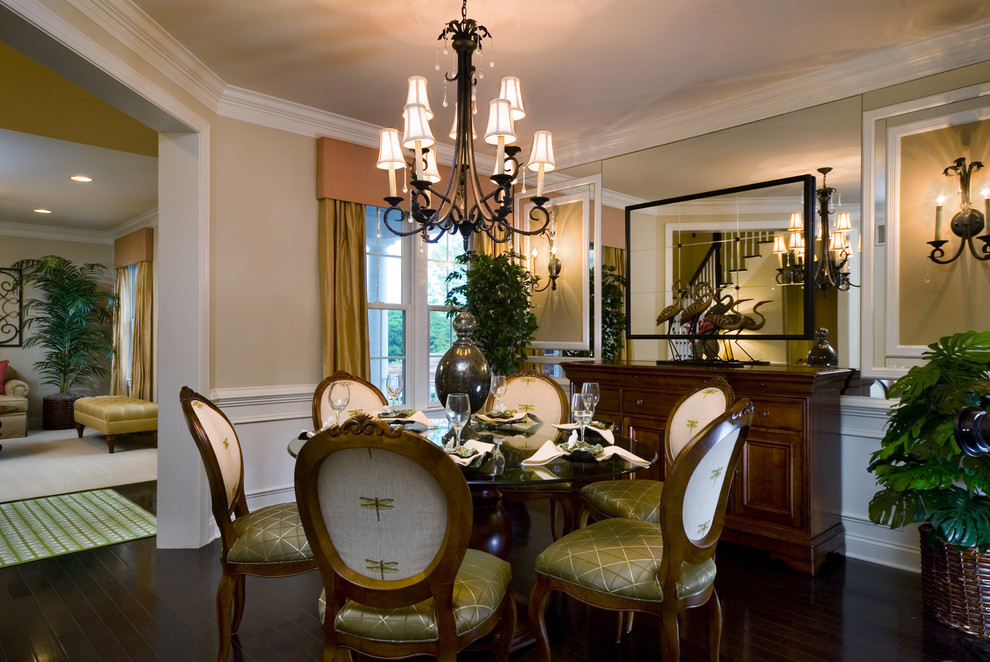 Photo of a traditional dining room in Los Angeles with beige walls and dark hardwood floors.