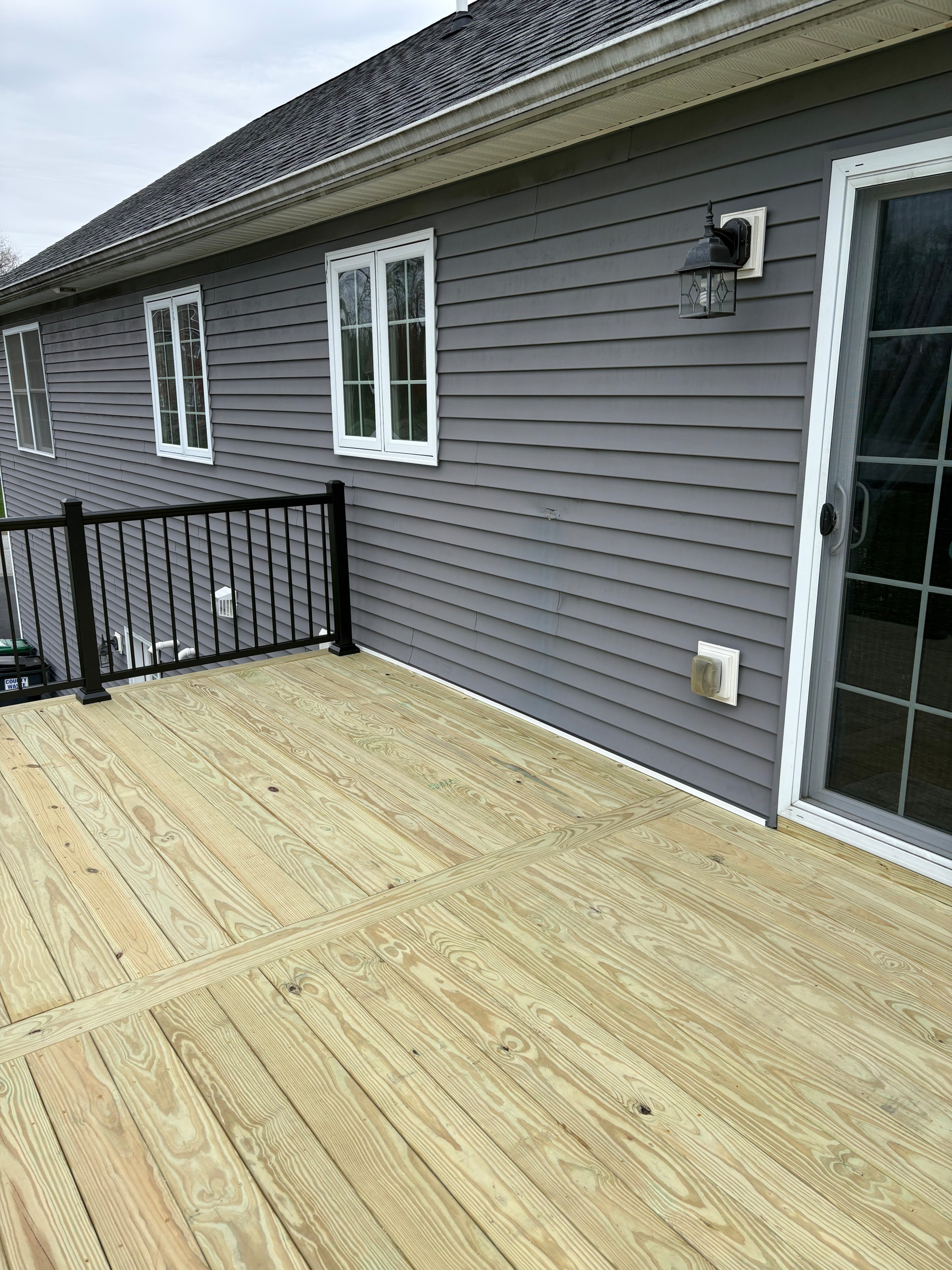 Pressure Treated Wood  Deck with black powder coated rail