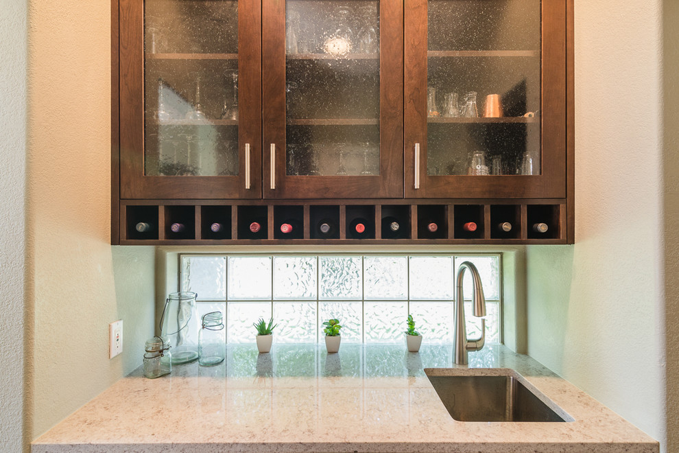 Example of a transitional home design design in Denver
