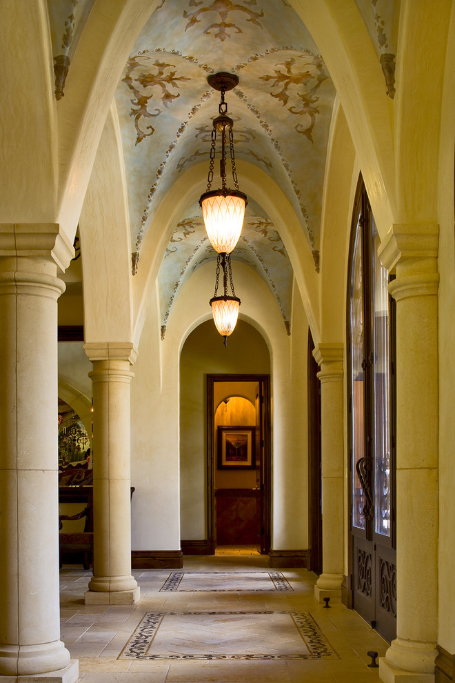 This is an example of a traditional hallway in Austin with beige walls.