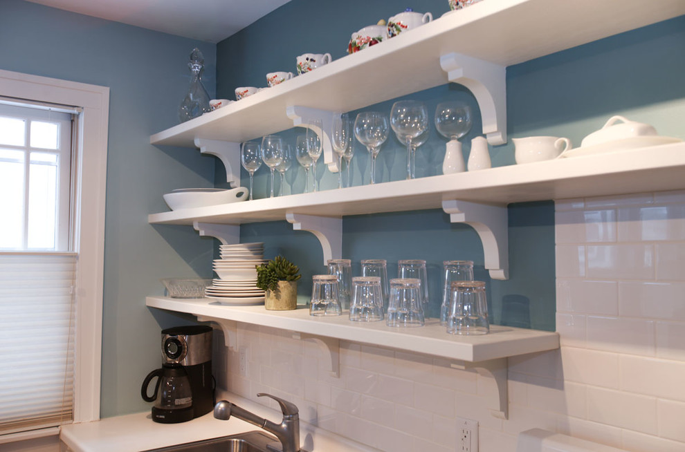 Example of a small transitional single-wall kitchen design in Minneapolis with a single-bowl sink, open cabinets, white cabinets, laminate countertops, white backsplash and subway tile backsplash