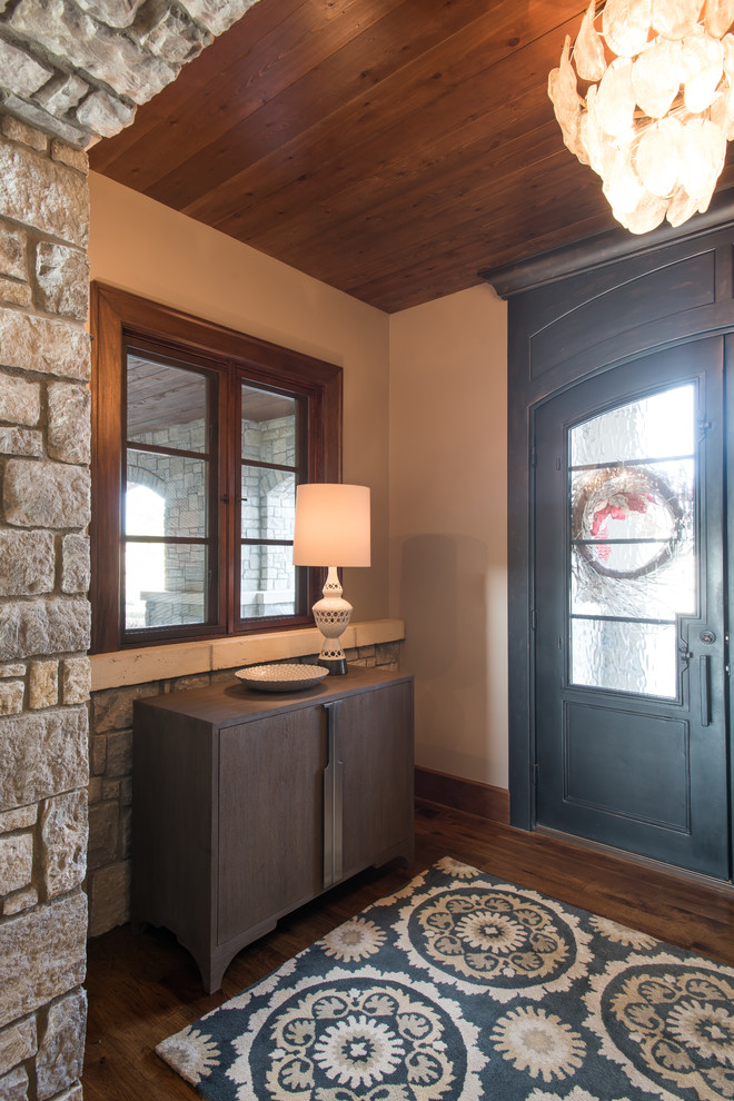 Example of a mid-sized transitional medium tone wood floor foyer design