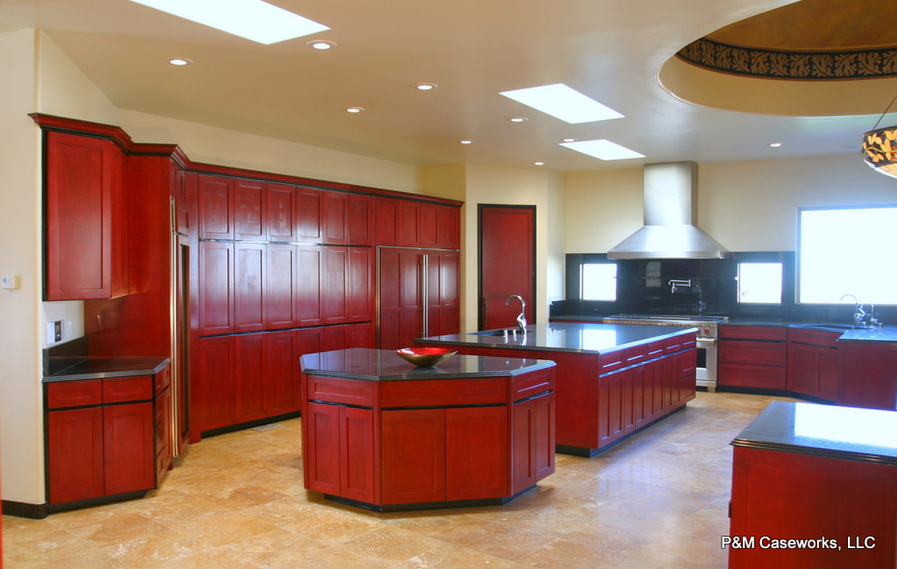 Design ideas for an expansive asian u-shaped kitchen pantry in Albuquerque with an undermount sink, shaker cabinets, red cabinets, black splashback, stainless steel appliances, travertine floors, multiple islands, granite benchtops, stone slab splashback and beige floor.