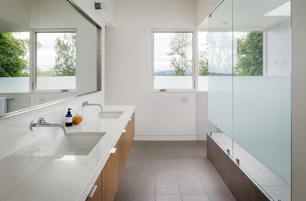 This is an example of a mid-sized modern master bathroom in Seattle with subway tile and an undermount sink.