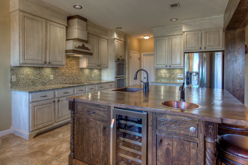 Eat-in kitchen - mid-sized rustic l-shaped eat-in kitchen idea in Austin with a single-bowl sink, wood countertops, stainless steel appliances and an island