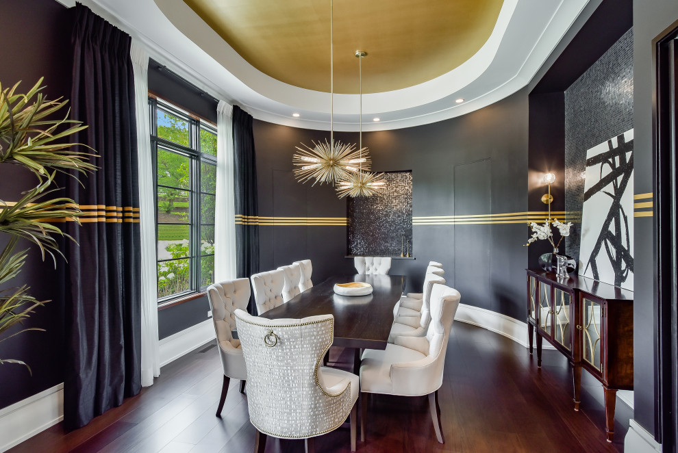 This is an example of a large contemporary separate dining room in Chicago with dark hardwood floors, no fireplace, brown floor, recessed and black walls.