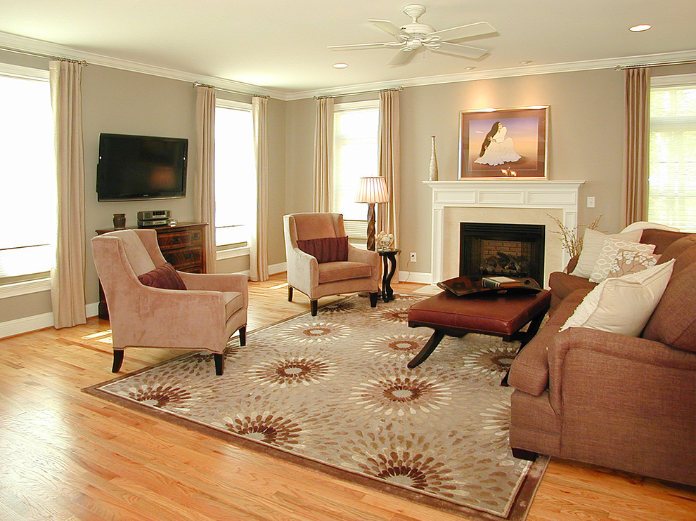 Inspiration for a traditional formal open concept living room in Bridgeport with grey walls, light hardwood floors, a stone fireplace surround and a wall-mounted tv.
