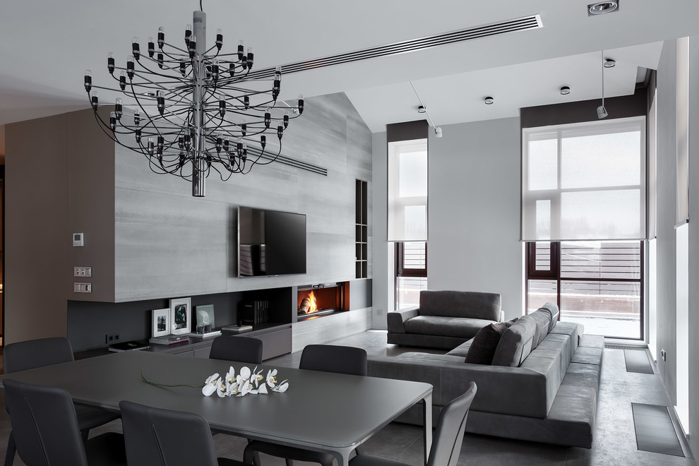 Photo of an expansive contemporary formal open concept living room in Saint Petersburg with grey walls, porcelain floors, a standard fireplace, a metal fireplace surround and a wall-mounted tv.