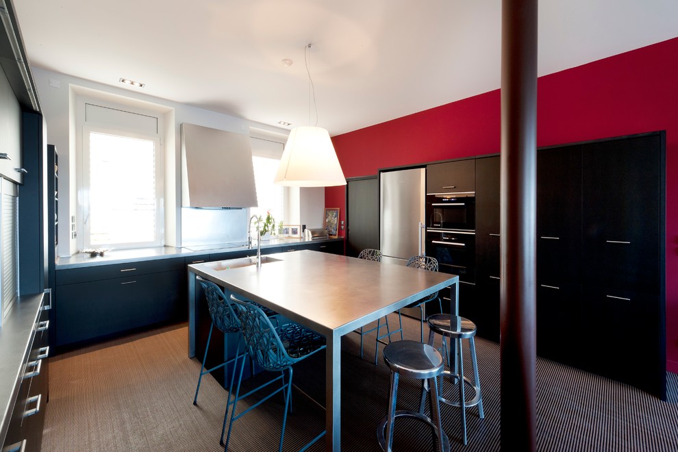 Photo of a large contemporary single-wall eat-in kitchen in Marseille with black cabinets and with island.