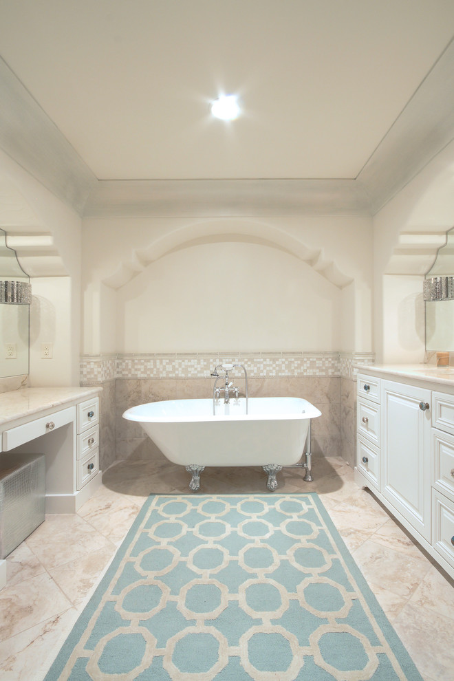 This is an example of a mid-sized mediterranean master bathroom in Austin with a claw-foot tub, mosaic tile, beaded inset cabinets, white cabinets, multi-coloured walls, travertine floors and engineered quartz benchtops.
