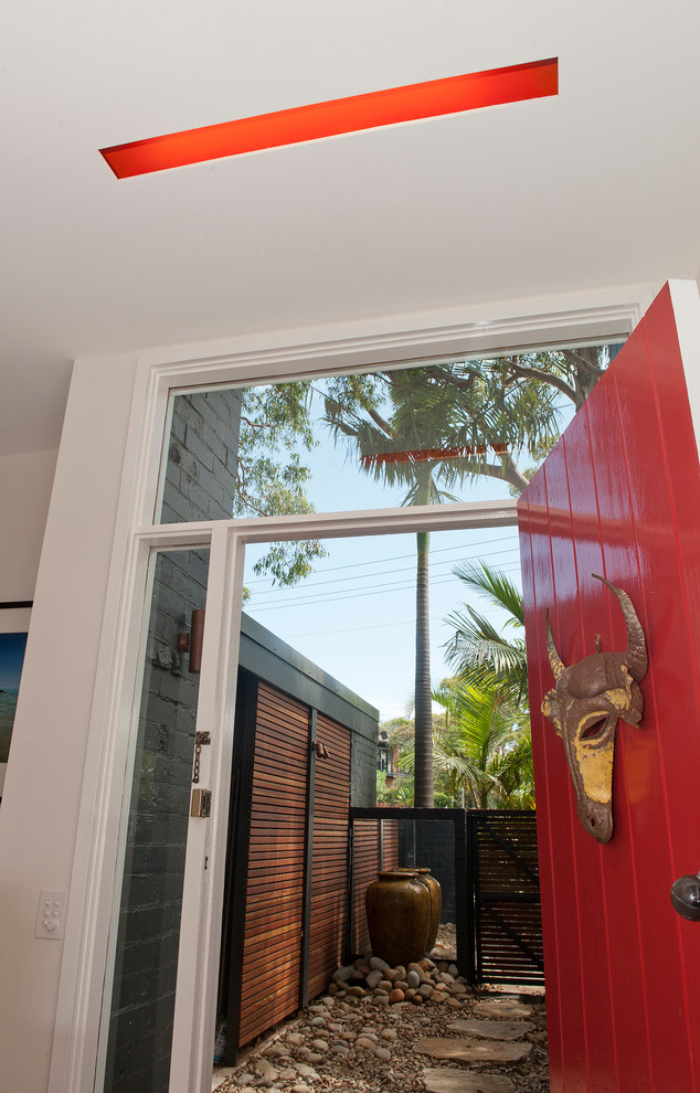 Design ideas for a mid-sized contemporary front door in Sydney with white walls, a single front door and a red front door.