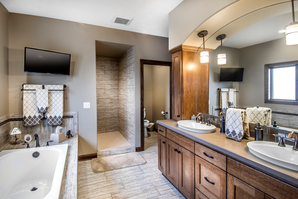Design ideas for a contemporary master bathroom in Other with recessed-panel cabinets, medium wood cabinets, a drop-in tub, beige tile, ceramic tile, beige walls and ceramic floors.