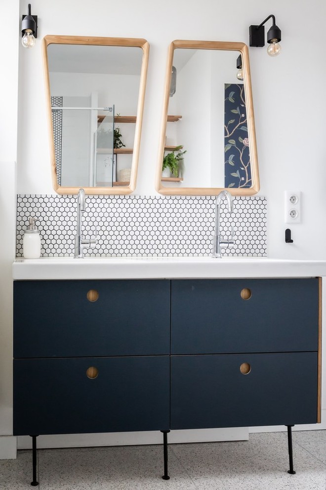 Inspiration for a small contemporary 3/4 bathroom in Paris with flat-panel cabinets, blue cabinets, a curbless shower, a wall-mount toilet, white tile, ceramic tile, white walls, terrazzo floors, an integrated sink, grey floor and white benchtops.